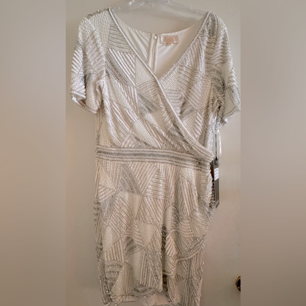 LARA Designs size 16. Dress is white sequined w/white and silver sequins.